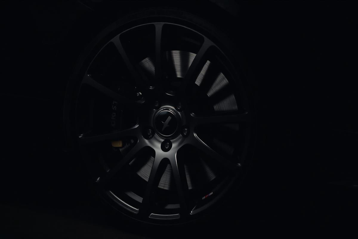 Detailed black alloy wheel